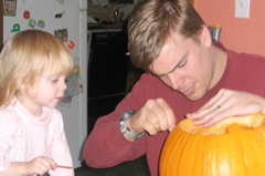 Maya and Dad carving pumpkin 3