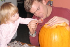Maya helping Dad carve